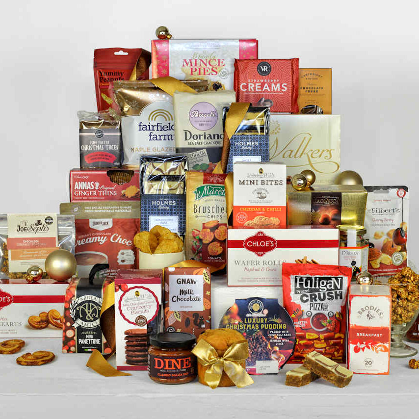 Christmas sharing food including Christmas pudding, mince pies, biscuits, popcorn, tea, hot chocolate, nuts chocolates fudge and other tasty treats
