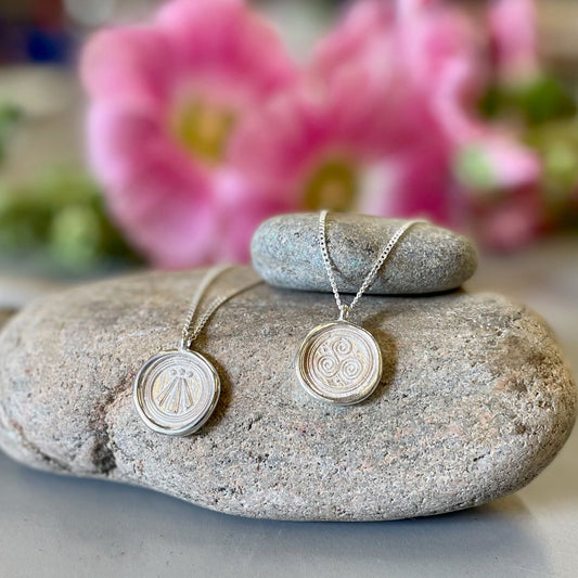 Symbolic Silver Pendants